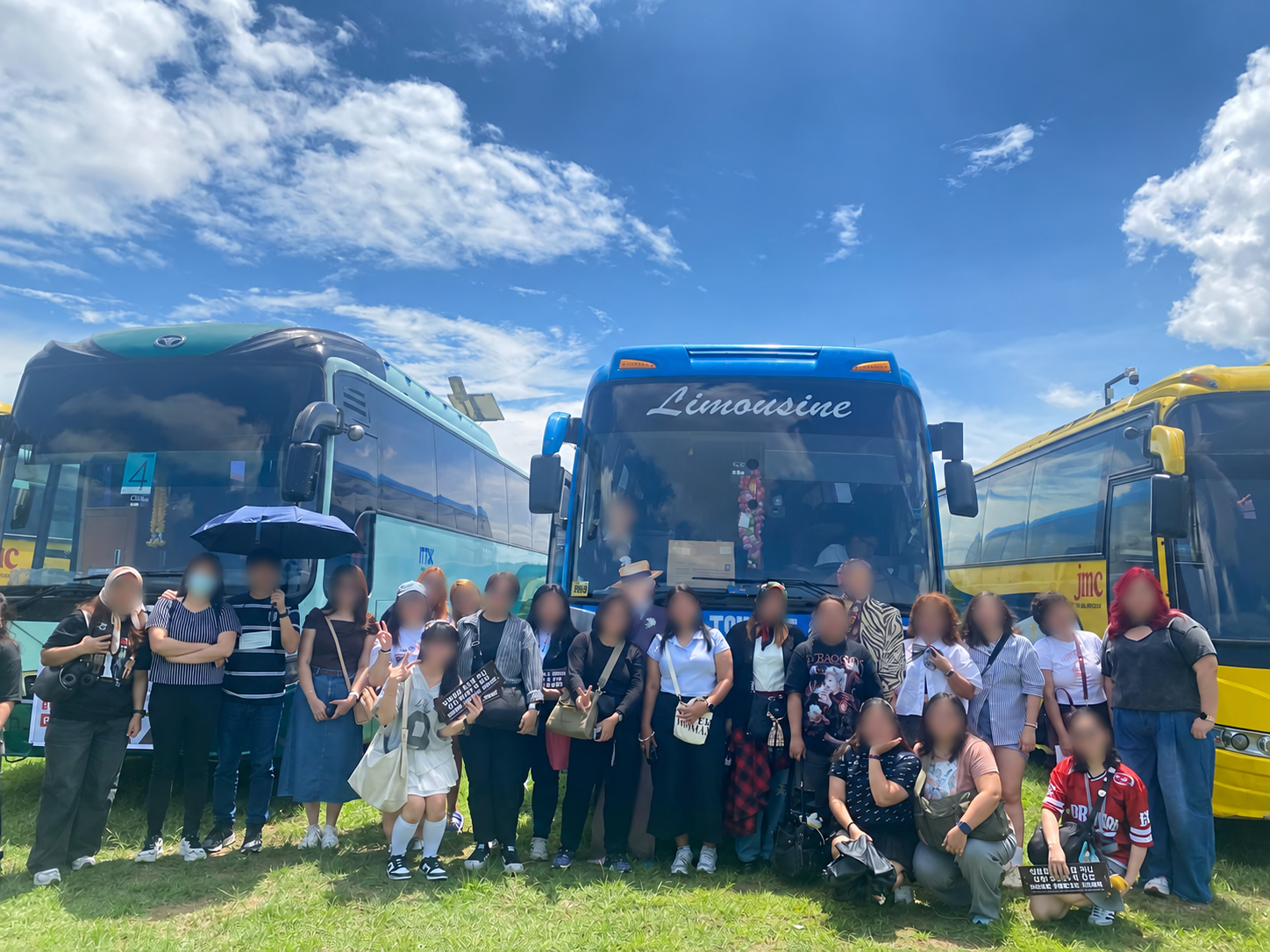 Fans from a previous FansOnBoard PH trip together beside their bus, with faces blurred
